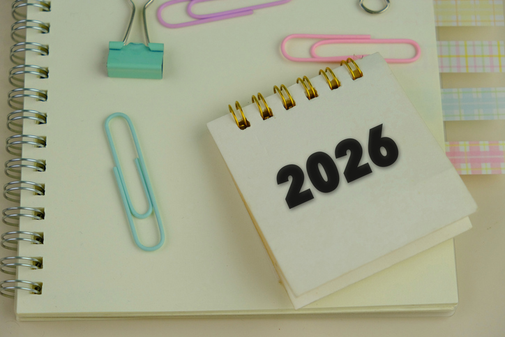 word 2026 on green calendar nearby colorful office tools as a 2026 calendar concept